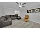 Open-concept living room showcasing a dark leather sofa and neutral tones at 2080 Karen Ave # 1, Las Vegas, NV 89169