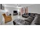 Comfortable living room with leather sectional, ceiling fan, and natural light at 2080 Karen Ave # 1, Las Vegas, NV 89169