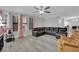 Inviting living room featuring modern gray flooring and a comfortable sectional sofa at 2080 Karen Ave # 1, Las Vegas, NV 89169
