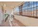 Enclosed patio with brick flooring, sun protection, and room for plants and a small table at 2080 Karen Ave # 1, Las Vegas, NV 89169