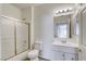 This bathroom includes a shower with sliding glass doors, vanity, and updated lighting at 2117 Echo Bay St # 102, Las Vegas, NV 89128