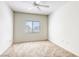 This bedroom has a ceiling fan, neutral carpet, and one window at 2117 Echo Bay St # 102, Las Vegas, NV 89128