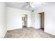 This bedroom has neutral carpet, bright white walls, and two doors at 2117 Echo Bay St # 102, Las Vegas, NV 89128
