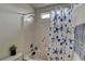 Bright bathroom featuring a tiled shower and tub with stylish starfish shower curtain at 2130 Trebbiano Way, Las Vegas, NV 89156