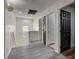 View of the upstairs hallway with modern light fixtures and laminate flooring at 2130 Trebbiano Way, Las Vegas, NV 89156