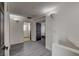 Upstairs hallway with laminate flooring, doors, and access to bedrooms at 2130 Trebbiano Way, Las Vegas, NV 89156