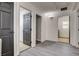 Hallway with multiple doorways showcasing a spacious design with stylish flooring at 2130 Trebbiano Way, Las Vegas, NV 89156