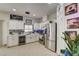 Modern kitchen with white cabinets, stainless steel appliances, and stylish countertops offers a clean and functional space at 2130 Trebbiano Way, Las Vegas, NV 89156