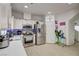 Bright, modern kitchen with stainless steel appliances, white cabinets, and an open layout at 2130 Trebbiano Way, Las Vegas, NV 89156