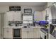 Beautifully updated kitchen with stainless steel appliances, quartz countertops, and modern fixtures at 2130 Trebbiano Way, Las Vegas, NV 89156