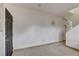 Minimalist living room featuring tile flooring and neutral walls providing a bright and spacious atmosphere at 2130 Trebbiano Way, Las Vegas, NV 89156