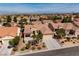Beautiful aerial view of a well-maintained home and landscaping, with a view of the city in the distance at 2219 Sawtooth Mountain Dr, Henderson, NV 89044