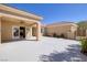 Back patio with covered area, perfect for relaxing and entertaining outdoors, and a view of the rest of property at 2219 Sawtooth Mountain Dr, Henderson, NV 89044