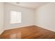 Cozy bedroom featuring wood floors, bright natural light, and neutral color scheme at 2219 Sawtooth Mountain Dr, Henderson, NV 89044