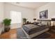 Well-lit staged bedroom with a comfortable bed, plants, and modern decor at 2219 Sawtooth Mountain Dr, Henderson, NV 89044