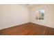 Bedroom with gleaming wood floors, and a window filling the space with natural light at 2219 Sawtooth Mountain Dr, Henderson, NV 89044