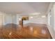 Spacious living room features hardwood floors, bright windows, and an open layout leading to the kitchen at 2219 Sawtooth Mountain Dr, Henderson, NV 89044