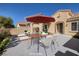 The patio features comfortable seating and an umbrella-covered table, perfect for outdoor entertaining and relaxation at 2219 Sawtooth Mountain Dr, Henderson, NV 89044