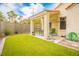 Inviting backyard with green space and a charming covered patio at 2251 Van Gogh Dr, Henderson, NV 89074