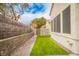 Well-maintained backyard with lush green lawn, perfect for outdoor activities and enjoying nature at 2251 Van Gogh Dr, Henderson, NV 89074