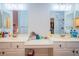 Bathroom featuring dual sinks, vanity and framed mirrors at 2251 Van Gogh Dr, Henderson, NV 89074
