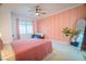 Cozy bedroom with unique paneling and neutral decor, creating a relaxing atmosphere at 2251 Van Gogh Dr, Henderson, NV 89074