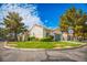 Charming home with mature trees, well-manicured lawn, desert landscaping, and spacious driveway at 2251 Van Gogh Dr, Henderson, NV 89074