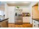 A modern kitchen with stainless steel refrigerator and updated appliances at 2251 Van Gogh Dr, Henderson, NV 89074