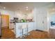 An open kitchen with white cabinets, stainless steel appliances, and breakfast bar seating at 2251 Van Gogh Dr, Henderson, NV 89074