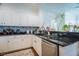 Functional kitchen showcasing stainless steel appliances, white cabinets, and granite countertops at 2251 Van Gogh Dr, Henderson, NV 89074