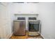 Convenient laundry area with a washer, dryer, and cabinet storage at 2251 Van Gogh Dr, Henderson, NV 89074
