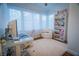 Bright office space featuring a large window, modern desk and cozy chair at 2251 Van Gogh Dr, Henderson, NV 89074