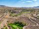Scenic aerial view showcasing lush golf course, winding paths, and the surrounding community at 2295 Otter Rock Ave, Henderson, NV 89044