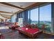 Inviting billiards room with large windows offering scenic views and plenty of natural light at 2295 Otter Rock Ave, Henderson, NV 89044