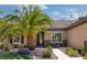Inviting home showcasing a tile roof, stone accents, lush landscaping, and a welcoming walkway at 2295 Otter Rock Ave, Henderson, NV 89044