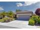 Attractive single-Gathering home with a two-car garage, manicured landscaping, and a tile roof at 2295 Otter Rock Ave, Henderson, NV 89044