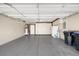 Spacious garage offering ample storage with built-in cabinets and epoxy flooring at 2295 Otter Rock Ave, Henderson, NV 89044