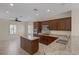 Bright kitchen with a center island, granite countertops, and stainless steel appliances at 2295 Otter Rock Ave, Henderson, NV 89044