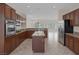 Open kitchen featuring stainless appliances and center island, flowing into the rest of the house at 2295 Otter Rock Ave, Henderson, NV 89044