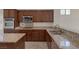 Close-up of the kitchen showcasing granite countertops and stainless steel appliances at 2295 Otter Rock Ave, Henderson, NV 89044