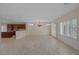 Expansive living area with tile floors, a chandelier, and open access to the kitchen at 2295 Otter Rock Ave, Henderson, NV 89044