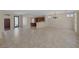 Bright, open-concept living space with tile floors, seamless flow, and kitchen access at 2295 Otter Rock Ave, Henderson, NV 89044
