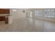 Open-concept living space boasts tile flooring, shuttered windows, and a chandelier at 2295 Otter Rock Ave, Henderson, NV 89044