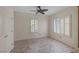 Room with neutral walls, tile floor, and window with white shutters at 2295 Otter Rock Ave, Henderson, NV 89044