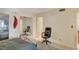 Bedroom featuring tile floors, mirrored closet doors, and an adjacent seating area at 2325 Sombrero Dr, Las Vegas, NV 89169