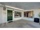 Covered carport featuring a green front door and large windows showcasing the home's interior at 2325 Sombrero Dr, Las Vegas, NV 89169