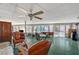 Spacious sunroom features an indoor/outdoor feel, ceiling fan and many seating options at 2325 Sombrero Dr, Las Vegas, NV 89169