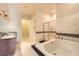 Bright bathroom featuring a tub, walk-in shower with glass door and double sink vanity at 2455 W Serene Ave # 923, Las Vegas, NV 89123
