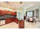 Open kitchen and dining area with stainless steel appliances, dark cabinetry, and tile flooring at 2455 W Serene Ave # 923, Las Vegas, NV 89123