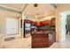 Modern kitchen with stainless steel appliances, dark wood cabinetry, and mosaic tile backsplash at 2455 W Serene Ave # 923, Las Vegas, NV 89123